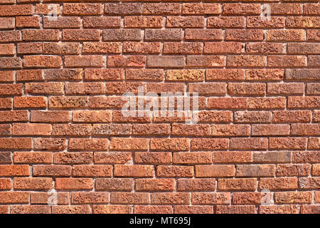 Close up view of an old vintage textured brick wall background with reddish brown bricks in traditional running bond pattern Stock Photo