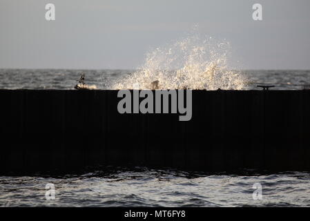 Lake Ontario water splashes against the peer at Fair Haven New York State Park, September 09, 2015 Stock Photo