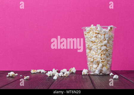 Popcorn In Bucket on the Pink Background. Stock Photo