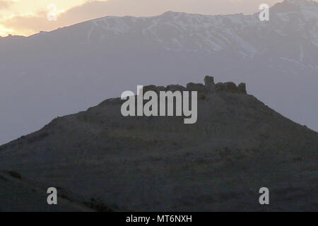 The sunsets behind the ruins of an outpost of Alexander the Great as seen from Advising Platform Lightning Apr. 2, the ruins are just one example of the history of Afghanistan that is near Gardez, Afghanistan. (U.S. Army photo provided by Sgt. Christopher B. Dennis, 1st Cavalry Division PAO.) Stock Photo