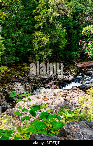 Slabs of angular igneous looking rocks lie at angles one on another at ...