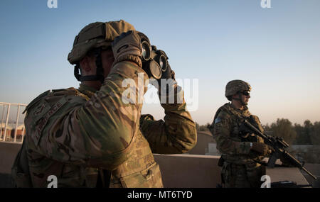 Senior Airman Richard Lawrence, a personnelist from the 451st Expeditionary Support Squadron, provides overwatch at Kandahar Airfield, Afghanistan. Personnelists with the 451st ESPTS in and out-processes all members at KAF, handles decorations and other personnel functions. All Airmen, regardless of position, are responsible for the security and safety of the installation. (U.S. Air Force photo by Staff Sgt. Benjamin Gonsier) Stock Photo