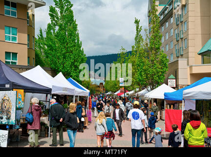 Busy shoppers at the Whistler Farmers Market in May 2018. Stock Photo
