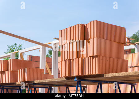 Stack of building bricks on construction site Stock Photo