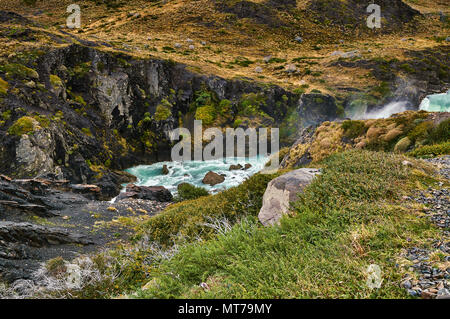 View of the Salto Grande waterfall in the Torres Del Paine park in cloudy weather. Chilean Patagonia in Autumn Stock Photo