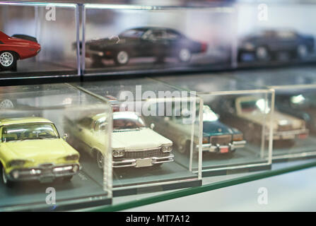 Collection of retro toy car models in shop window. Stock Photo