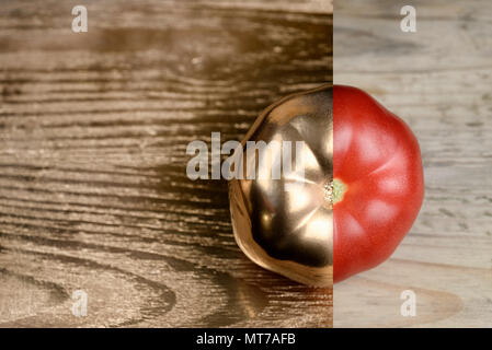Creative layout made of tomato. Golden paint and natural. Food concept. Stock Photo