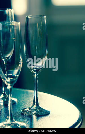 Three champagne glasses on a table. Stock Photo