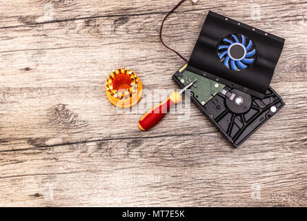 cooler on hard disk with screwdriver bits. Stock Photo
