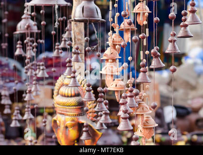 Beautiful garden ornaments—bells, beads, birds, Ganesha—made of clay/ceramic on sale at Shilparamam arts and crafts village in Hyderabad, India. Stock Photo