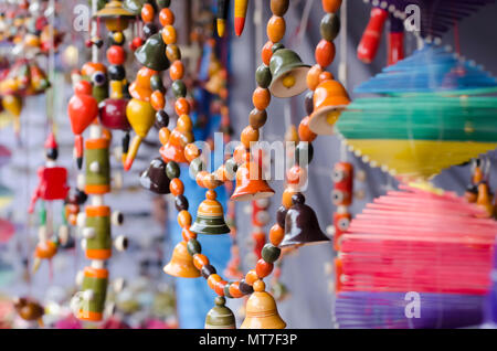 Multicoloured/Multicolored garden ornaments—bells, beads,—made of clay/ceramic on sale at Shilparamam arts and crafts village in Hyderabad, India. Stock Photo