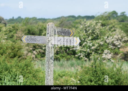 Public Footpath Signpost at Pagham Harbour Nature Reserve, West Sussex, UK. Stock Photo