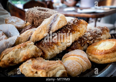 Different kinds of bread rolls on black board from above. Stock Photo