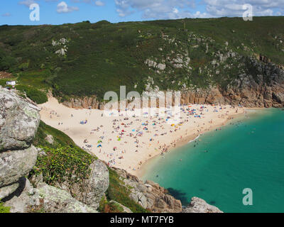 Beach at Pothcurno Bay / Cove in Cornwall, England, UK, showing the beach on a summer day. Aerial shot of holidaymakers sunbathing and swimming. Stock Photo