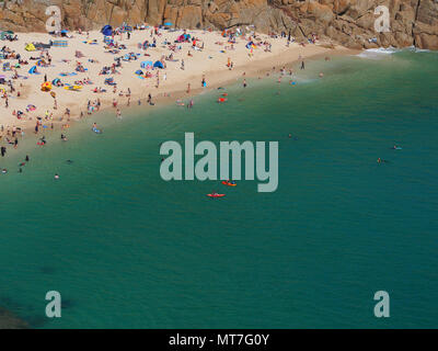 Beach at Pothcurno Bay / Cove in Cornwall, England, UK, showing the beach on a summer day. Aerial shot of holidaymakers sunbathing and swimming. Stock Photo