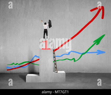 Cheered businessman standing on podium with 3 trends in concrete background Stock Photo
