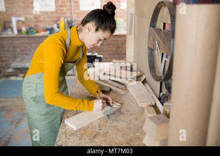 Female Artisan Working with Wood Stock Photo