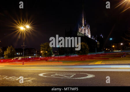 Rotherham Minster (All Saints Church of England) at night with light trails from a car; View of Rotherham town centre, South Yorkshire, England Stock Photo