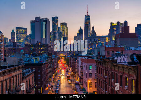 View of Madison Street and Lower Manhattan at sunset from the Manhattan Bridge in New York City Stock Photo