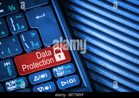 Close up of computer laptop keyboard with red button Data Protection concept and copy space. Idea of Internet security, data privacy, cyber crime prev Stock Photo
