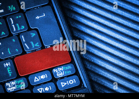 Close up of computer laptop keyboard with a blank red button for any message and copy space. Conceptual image of an alert, danger, warning, announceme Stock Photo