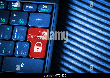 Close up of computer laptop keyboard with red button Data Protection concept and copy space. Idea of Internet security, data privacy, cyber crime prev Stock Photo