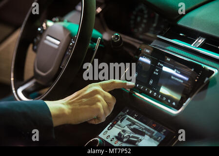 Belgrade, Serbia - March 22, 2018: Using navigation system on dashboard of modern car Stock Photo