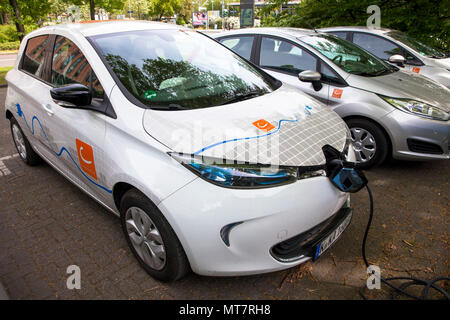 Renault ZOE of the carsharer Cambio at a charging station of the Mobilstation on the Charles-de-Gaulle square in the district Deutz, Cologne, Germany. Stock Photo