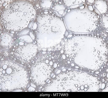 Full frame of the textures formed by the bubbles and drops in the shape of circle floating Stock Photo