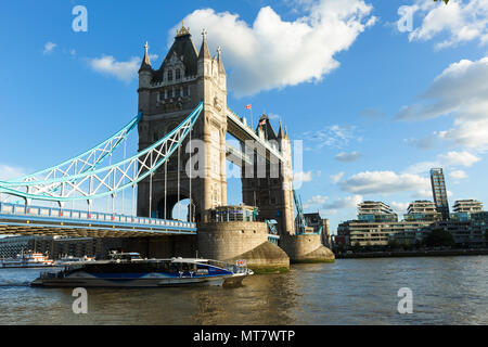 London, United Kingdom - JULY 31, 2017: Daylight Establishing Shot London Iconic Landmark Tower Bridge. Evening light. Pleasure boat