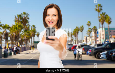 woman taking selfie by smartphone in los angeles Stock Photo