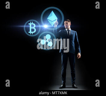 buisnessman with cryptocurrency holograms Stock Photo