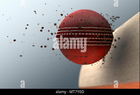 An extreme closeup slow motion action capture of a red cricket ball striking a wooden bat with dirt particles emanating on a dark isolated background  Stock Photo