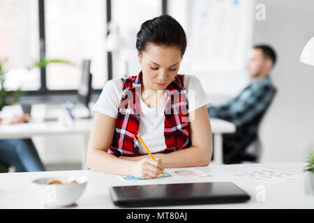 creative woman working on user interface at office Stock Photo