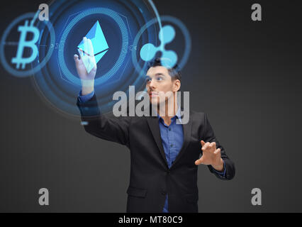 businessman with cryptocurrency holograms Stock Photo