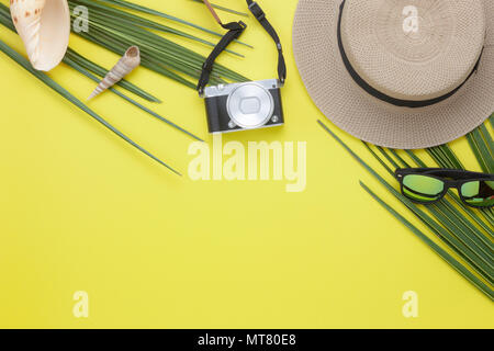 Table top view aerial image of summer & travel beach holiday in the season background concept.Flat lay camera & sunglasses with hat for traveler on mo Stock Photo