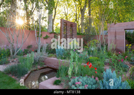 Sunrise over the M&G Garden designed by Sarah Price at The RHS Chelsea Flower Show 2018, London, UK Stock Photo