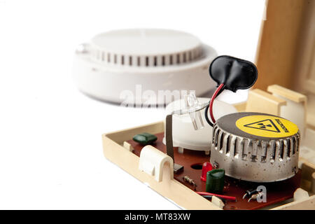 Old domestic smoke detector alarms on white background Stock Photo