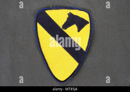 KIEV, UKRAINE - Feb 01, 2015. US ARMY 1st Cavalry Division patch on olive green uniform Stock Photo