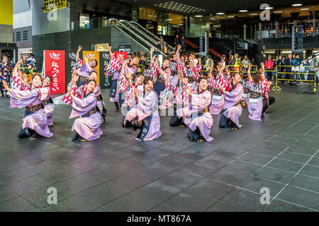 Japanese dancers performing yosakoi dance around Kyoto railway station Japan Stock Photo