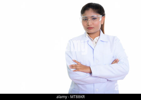 Studio shot of young fat Persian woman doctor wearing protective Stock Photo