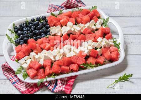 Patriotic American flag salad with blueberry, watermelon and feta Stock Photo