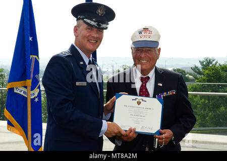 ARLINGTON, Va. --Maj. Gen. James Jacobson, Air Force District of Washington commander, and 2nd Lt. John Pedevillano stand by during a Purple Heart presentation ceremony in Pedevillano’s honor at the Air Force Memorial, Jul. 14, 2017.  Pedevillano, a B-17 bombardier pilot, received the award for wounds he incurred during a forced march as a World War II prisoner of war.  More than 15 of Pedevillano’s immediate family members attended the event along with U.S. Air Force personnel, members from the Military Order of the Purple Heart, friends and other guests. Stock Photo