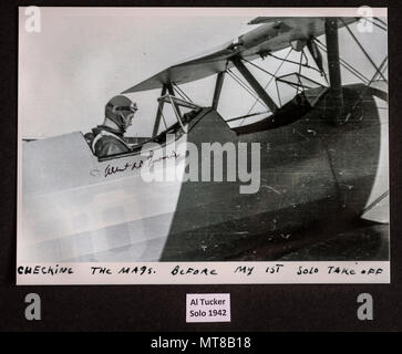 A photograph of Al Tucker Jr., preparing to takeoff for his first solo flight in a PT-17 Stearman at the United States Military Academy at West Point, N.Y. in 1942, adorns to wall of the hanger of First Sgt. David Brown, Air Force Reserve, at Warrenton-Fauquier Airport in Warrenton, Va., Jul. 20, 2017. Brown, who has been flying since he was a teenager and began working at the Flying Circus Aerodrome in Bealeton, Va., has been allowing Tucker, now 96, to fly his biplane for nearly 10 years. (U.S. Air Force photo by J.M. Eddins Jr.) Stock Photo