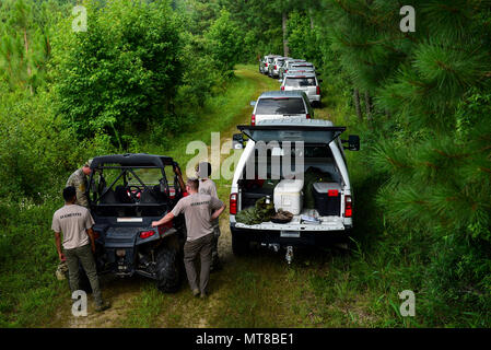 Survival, evasion, resistance and escape augmentees prepare to act as an opposing force and search for pilots and weapon systems officers from Seymour Johnson Air Force Base, North Carolina, during combat survival training, July 11, 2017, at Howell Woods, Four Oaks, North Carolina. During the training, pilots and WSOs attempted to evade the augmentees and state troopers from the NC State Highway. (U.S. Air Force photo by Airman 1st Class Kenneth Boyton) Stock Photo