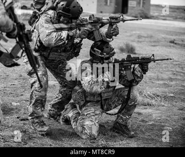 Two Pararescueman From The 308th Rescue Squadron Practice Shooting Tactics With Simulated Ammunition March 2 17