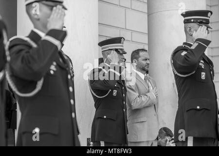 Micheal Migliara (center right), director of events and ceremonies, Arlington National Cemetery; renders honors during the playing of Taps at the Tomb of the Unknown Soldier at Arlington National Cemetery, Arlington, Virginia, May 11, 2018. (U.S. Army photo by Elizabeth Fraser / Arlington National Cemetery/ released) (This image was created in color and changed to black-and-white) Stock Photo