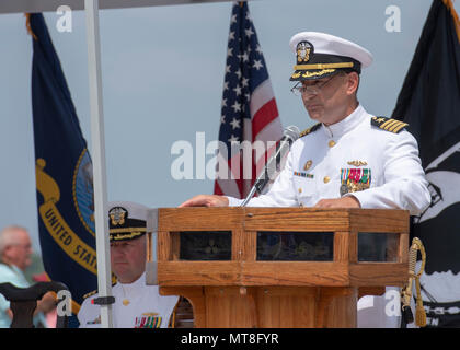 Capt. Robert A. Roncska, commander of Submarine Squadron 7, addresses  guests during a change of command and retirement ceremony on the submarine  piers at Joint Base Pearl Harbor-Hickam, Hawaii. - PICRYL 