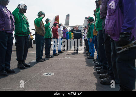 180514-N-AF077-0046 ATLANTIC OCEAN (May 14, 2018) Sideboys render honors to Chief of the French navy Adm. Christophe Prazuck upon his arrival aboard the aircraft carrier USS George H.W. Bush (CVN 77). The ship is underway in the Atlantic Ocean conducting carrier air wing exercises with the French navy to strengthen partnerships and deepen interoperability between the two nations' naval forces. (U.S. Navy photo by Mass Communication Specialist 1st Class Sean Hurt) Stock Photo