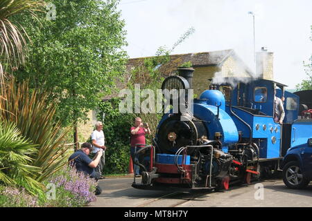 A bright blue steam engine on the garden railway at Adrian Shooter's The Beeches Light railway Stock Photo